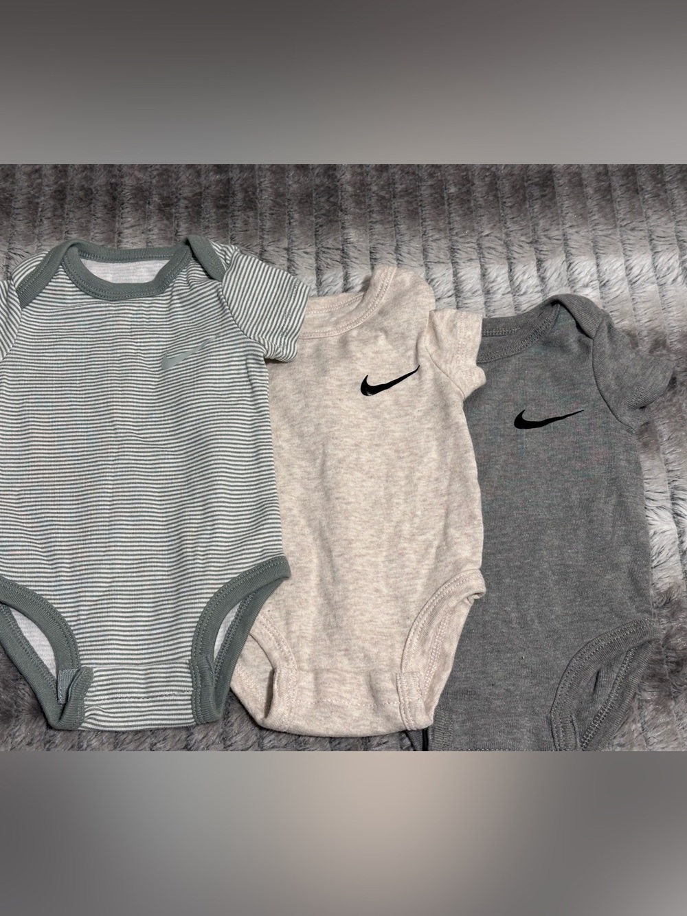 3 Nike Onesies 
Size 3 months